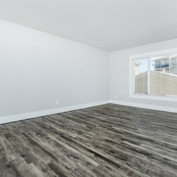 Living room with plank flooring at Stone Canyon Apartments, located in Colorado Springs, CO