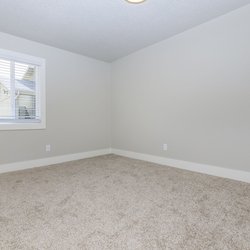 Carpeted primary bedroom at Stone Canyon Apartments, located in Colorado Springs, CO